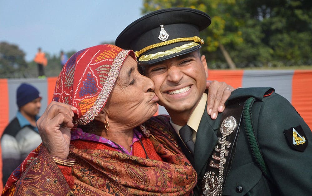 A gentleman cadet is greeted by his grandmother after the graduation ceremony at IMA Dehradun.