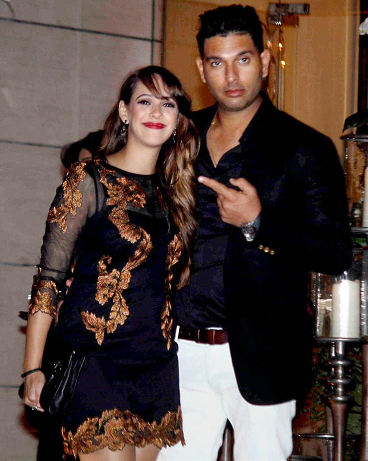 Cricketer Yuvraj Singh and Hazel Keech during a party to celebrate the recent weddings of Harbhajan Singh and Rohit Sharma.