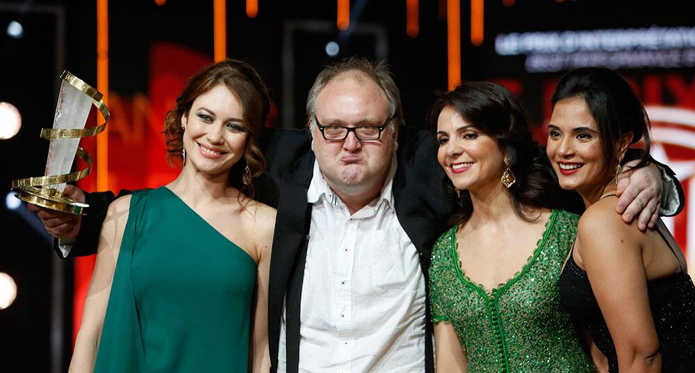 Gunnar Jonsson, Center, poses after winning the best actor award for the film Virgin Mountain  with jury members, Olga Kurylenko left Richa Chadda 2nd right and Amal Ayouch, right , during the closing ceremony of the the 15th Marrakech International Film.