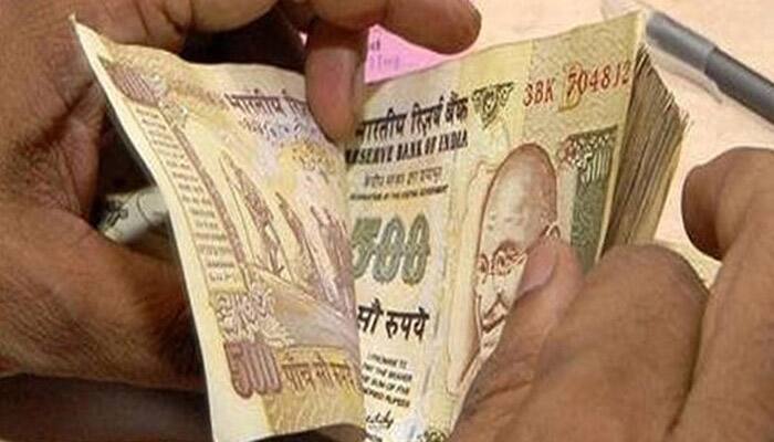 Rupee breaches 67-mark, falls 18 paise against dollar