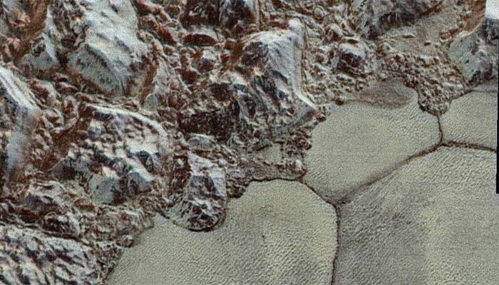 See mesmerising Pluto in colour now