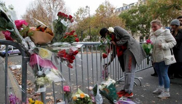 Suspect arrested over Paris terror attacks as raids continue across France