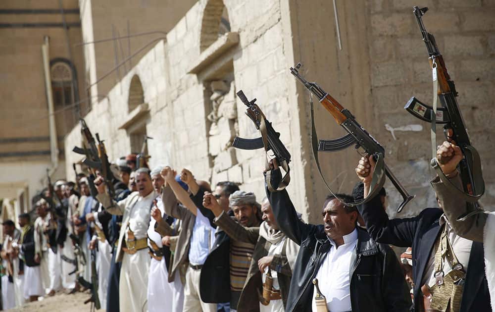 Shiite tribesmen, known as Houthis, hold their weapons as they chant slogans during a tribal gathering showing support for the Houthi movement in Sanaa, Yemen.