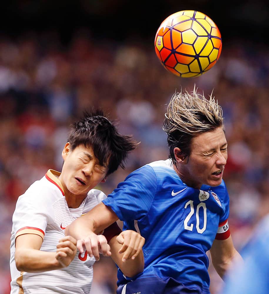 U.S. forward Abby Wambach (20) heads the ball on a corner kick as China's Wang Shanshan defends during the first period of an international friendly soccer match against China in New Orleans.