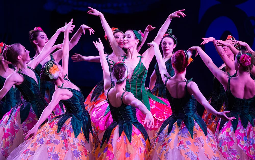 Corps de Ballet dancer Grace Shivers, center, performs with her company during the Cincinnati Ballet's dress rehearsal of the Nutcracker at the Aronoff Center.