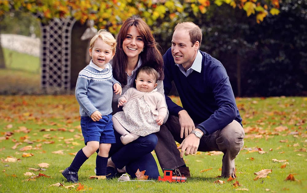 This photo released by Kensington Palace, shows The Duke and Duchess of Cambridge with their two children, Prince George and Princess Charlotte, in a photograph taken late October 2015 at Kensington Palace in London. 