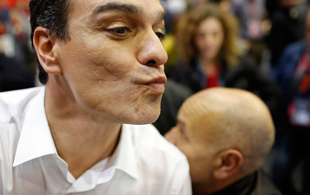 Socialist party leader Pedro Sanchez blows a kiss to supporters during the closing campaign rally in Barcelona, Spain.