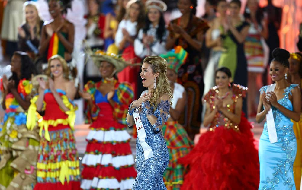 Newly crowned Miss World Mireia Lalaguna Royo from Spain, center reacts as she is announced the winner of the 2015 Miss World Grand Final in Sanya in south China's Hainan province.