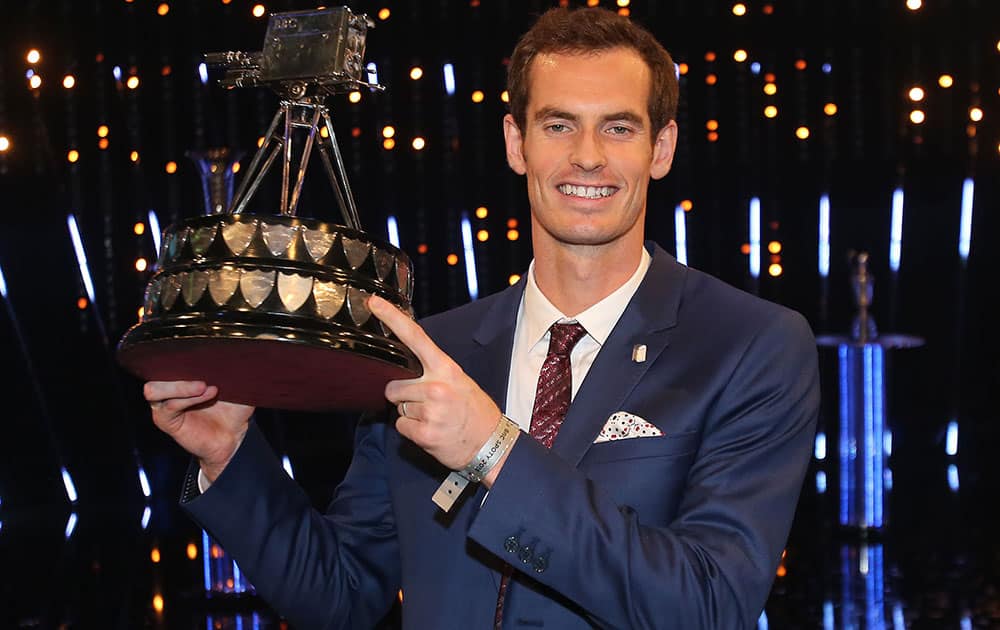 British tennis player Andy Murray poses with the trophy after winning the 2015 Sports Personality of the Year, in Belfast, Northern Ireland.