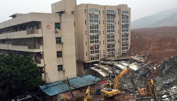 It&#039;s frightening! Landslide buries four-storey building in China – Watch