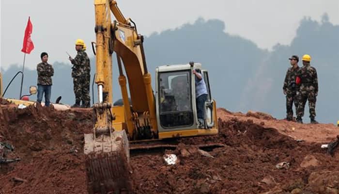 China landslide: First body retrieved; rescue operation on