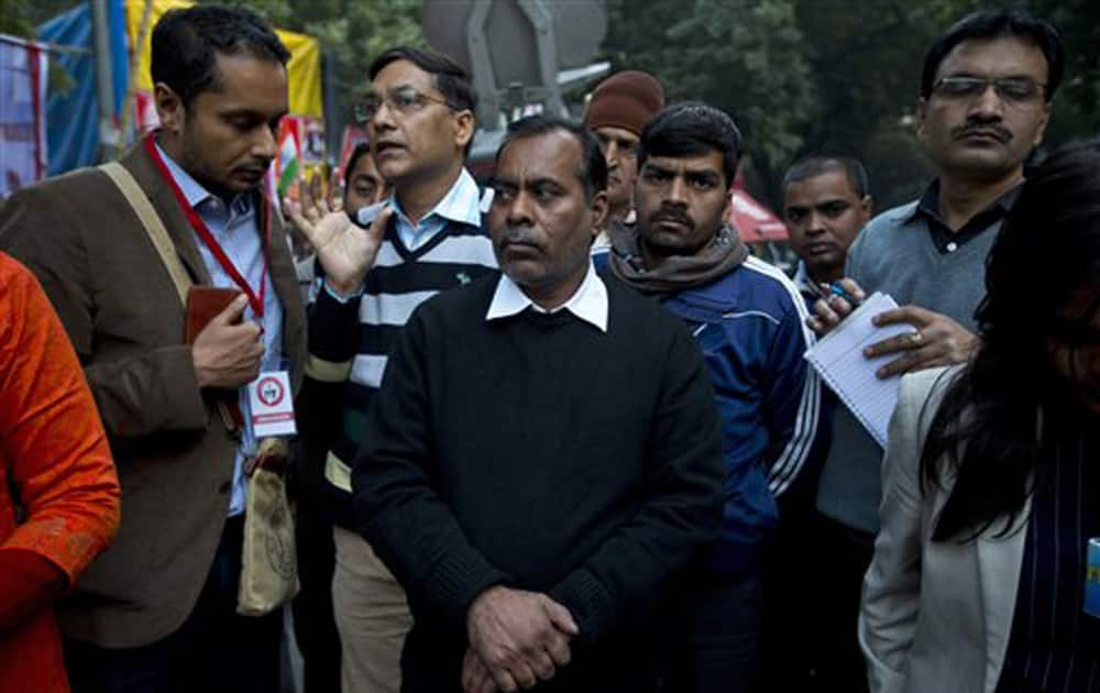 The father of the victim of the fatal 2012 gang-rape that shook India, arrives to lend his support at a protest in New Delhi.