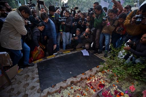 The mother of Dec 16 gang-rape victim arrives at a temporary shrine dedicated to her daughter at a protest in New Delhi. 