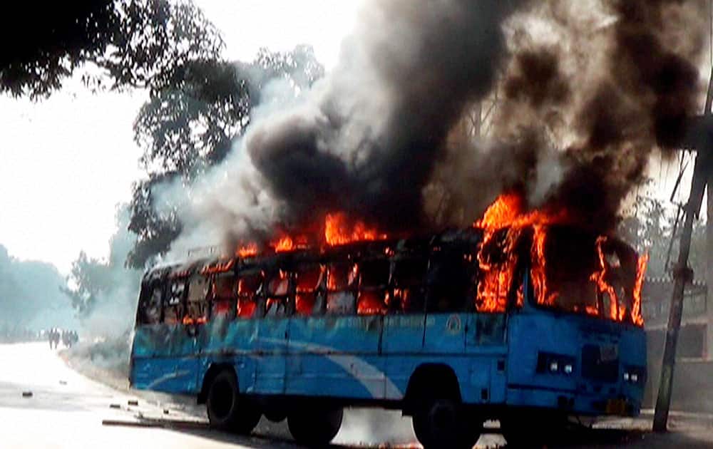 A government bus allegdly set on fire by the BJP activists during a protest in North Dinajpur district of West Bengal.