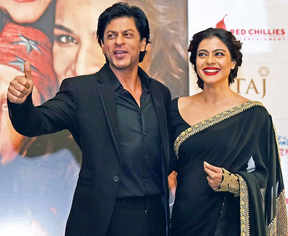 Bollywood actors Shahrukh Khan and Kajol pose during promotion of their new film Dilwale in Kolkata.