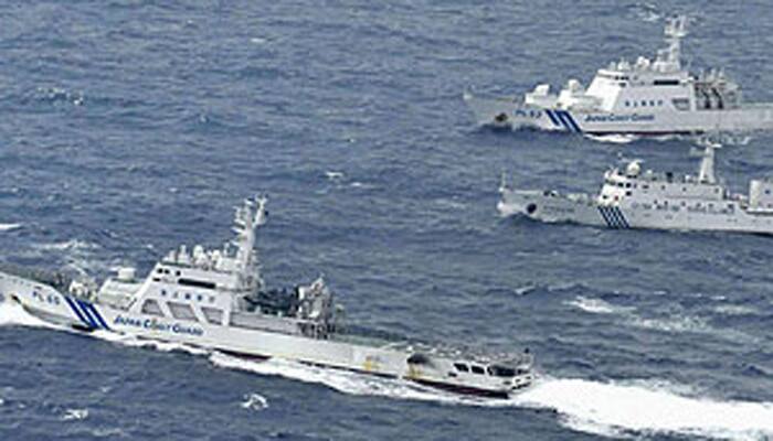 Japan says armed Chinese coastguard ship seen near disputed islands