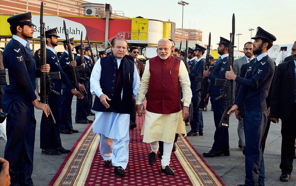 Prime Minister Narendra Modi is received by his Pakistani counterpart Nawaz Sharif upon his arrival in Lahore.