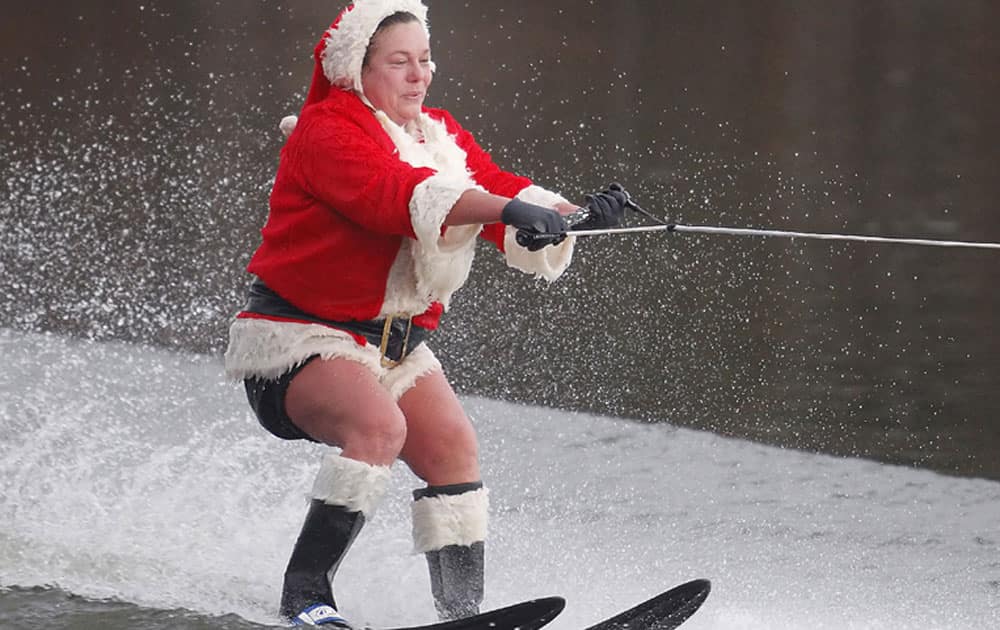 Janet Hurley-Quackenbush waterskis on Christmas Day at Goodyear Lake in Colliersville, New York, during unseasonably warm weather on Dec 25.
