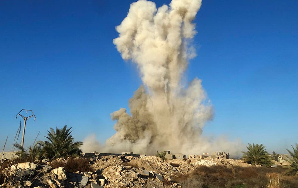 Smoke rises after Iraqi Security forces blew up a car bomb belonging to a suicide bomber with Islamic State group at Huz neighborhood in downtown Ramadi, 70 miles (115 kilometers) west of Baghdad, Iraq.