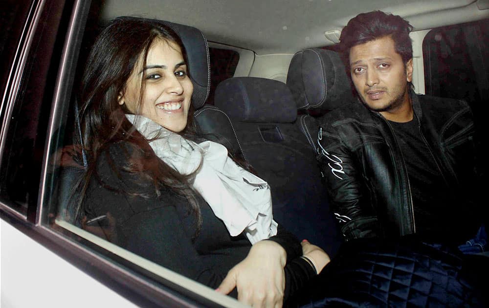 Actor Riteish Deshmukh with his wife and actor Genelia DSouza arrives for Salman Khans 50th birthday party at Panvel near Mumbai.