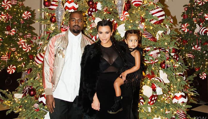 ELLE Magazine :- North West met Santa and it went WAY better this year. -twitter