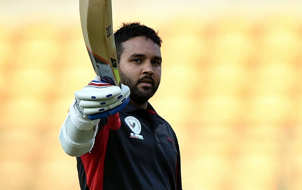 Gujarat Skipper Parthiv Patel celebrates his century against Delhi during the final match of the Vijay Hazare Trophy 2015 at Chinnaswamy Stadium in Bengaluru.
