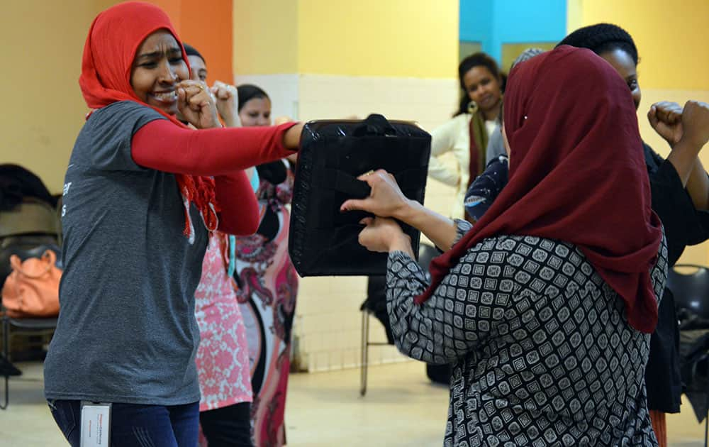 Rofaida Elzubair punches a target during a self defense class in Washington.