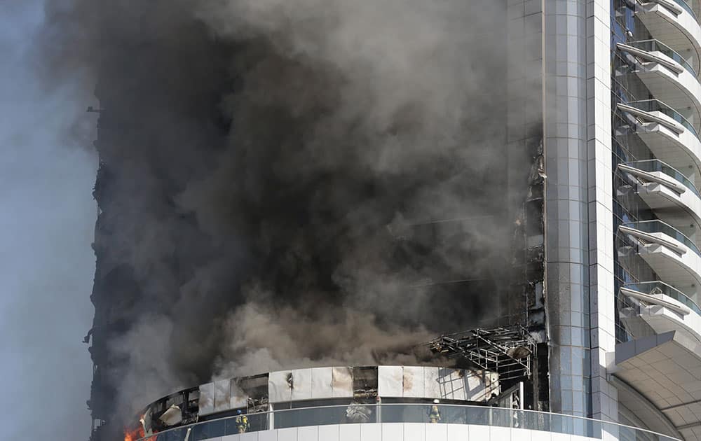 A fire burns in the Address Downtown skyscraper in Dubai, United Arab Emirates.