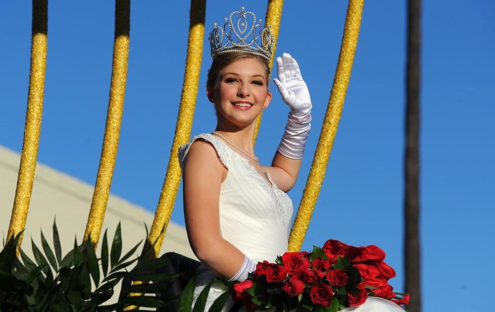 Rose Queen Erika Winter rides on a float in the 127th Rose Parade in Pasadena, Calif.