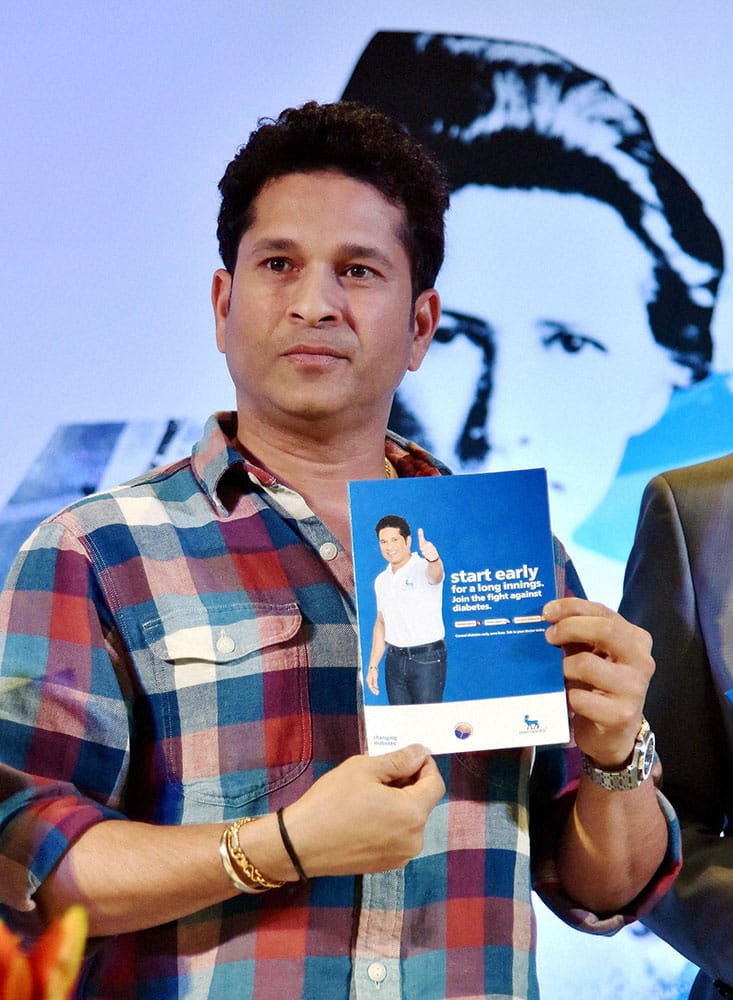 Cricket legend Sachin Tendulkar releases a brochure to create awareness on diabetes at a promotional event in Hyderabad.