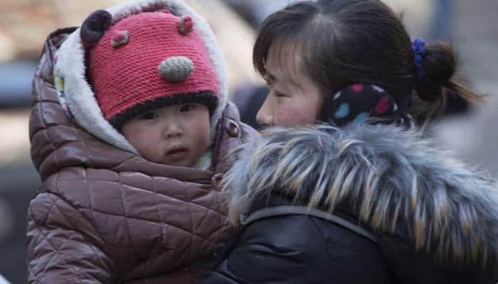 China scraps approvals for first, second children