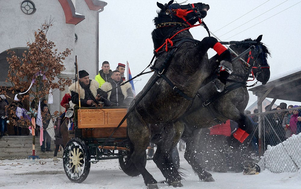 Bosnian Serb men ride horses as they prepare for a traditional parade for the Orthodox Christmas Eve, in the village of Glamocani near Bosnian town of Banja Luka, 350 km northwest of Sarajevo.