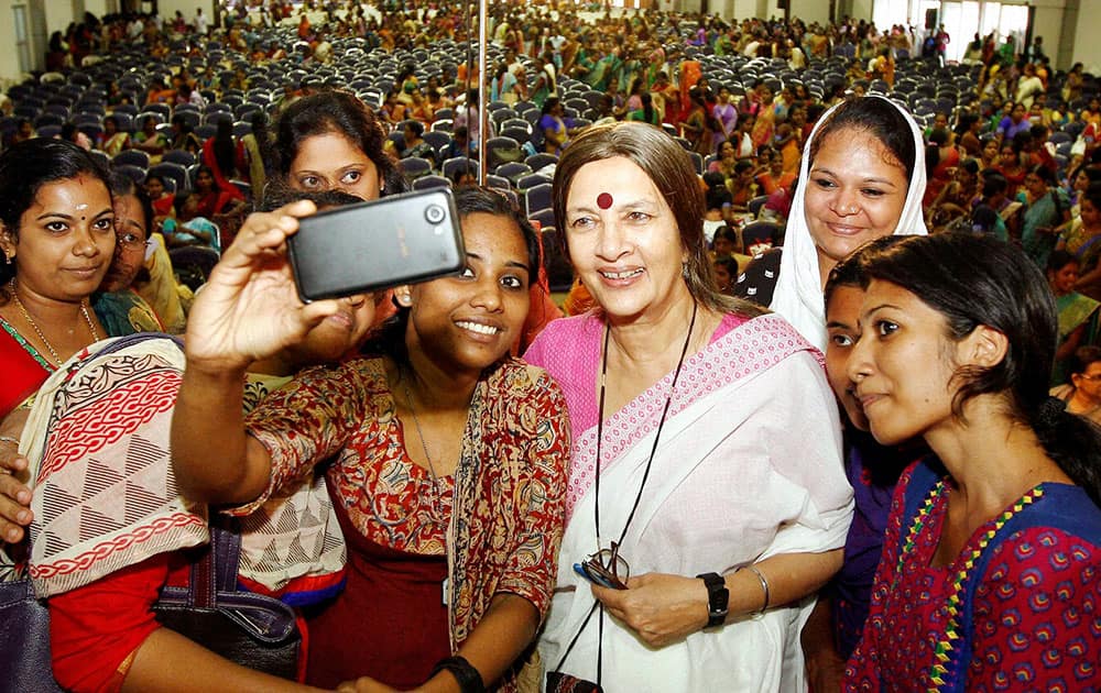 CPM politburo member Brinda Karat takes selfie with participants as she arrives for the inauguration of the Women’s Parliament function in Kochi.