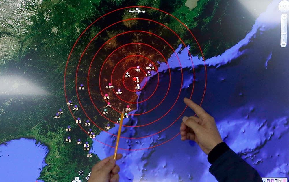 Officers from the Korea Meteorological Administration point at the epicenter of seismic waves in North Korea, at the National Earthquake and Volcano Center of the Korea Meteorological Administration in Seoul, South Korea.