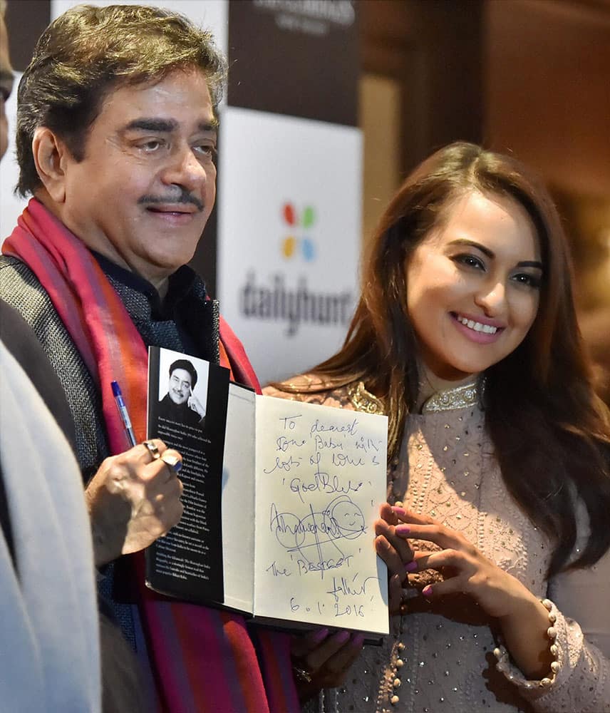 BJP MP Shatrughan Sinha with daughter actress Sonakshi Sinha during the release function of his book Anything But Khamosh in New Delhi.