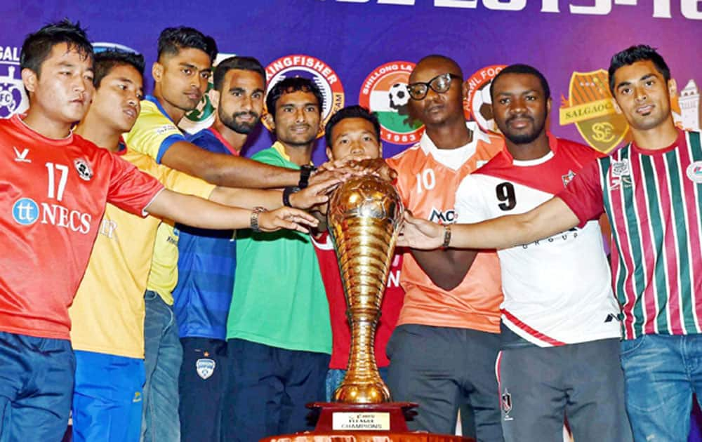 Captains of all nine clubs pose with the official trophy at the launch ceremony of I-League 2016 in Kolkata.