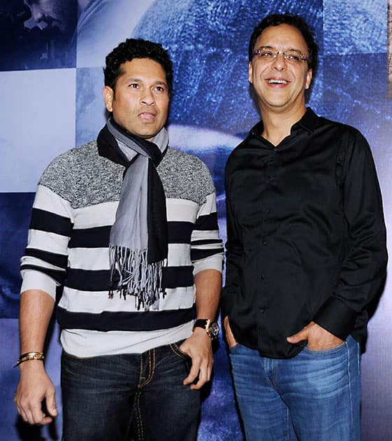 Cricket legend Sachin Tendulkar with Bollywood filmmaker Vidhu Vinod Chopra during the screening of film Wazir in Mumbai.