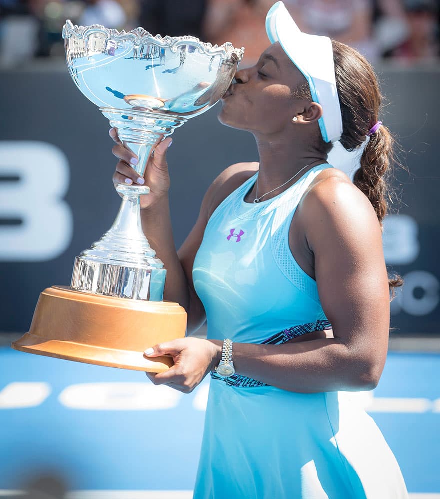 Sloane Stephens of the U.S. kisses her winner's trophy after defeating Julia Gorges of Germany in their final match at the ASB Classic tennis tournament in Auckland, New Zealand.