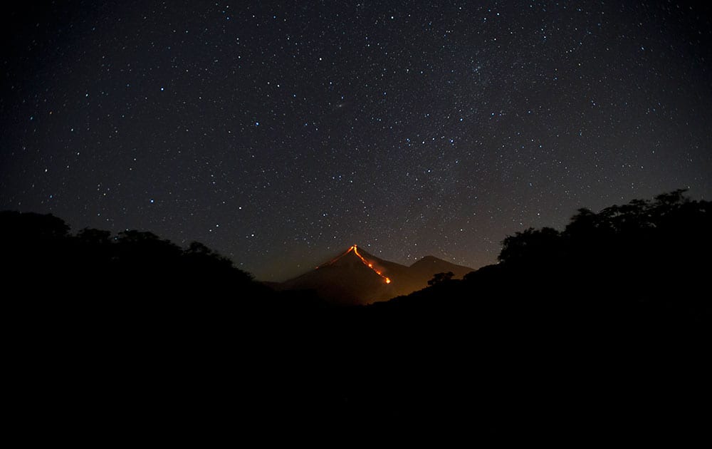 the Volcano of Fire releases lava, seen from Escuintla, Guatemala.