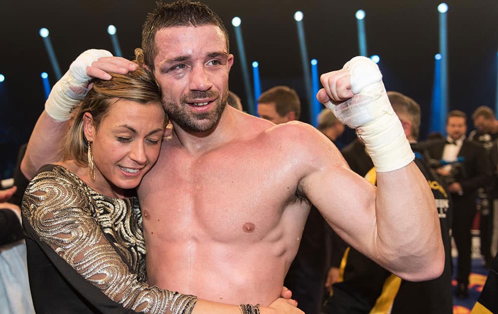 Giovanni De Carolis of Italy celebrates with his wife Victoria, left, after winning the WBA super-middleweight world championship bout against Vincent Feigenbutz of Germany in Offenburg, Germany. Giovanni De Carolis of Italy stopped Vincent Feigenbutz in the 11th round of their rematch to claim the vacant WBA super middleweight title on Saturday. 
