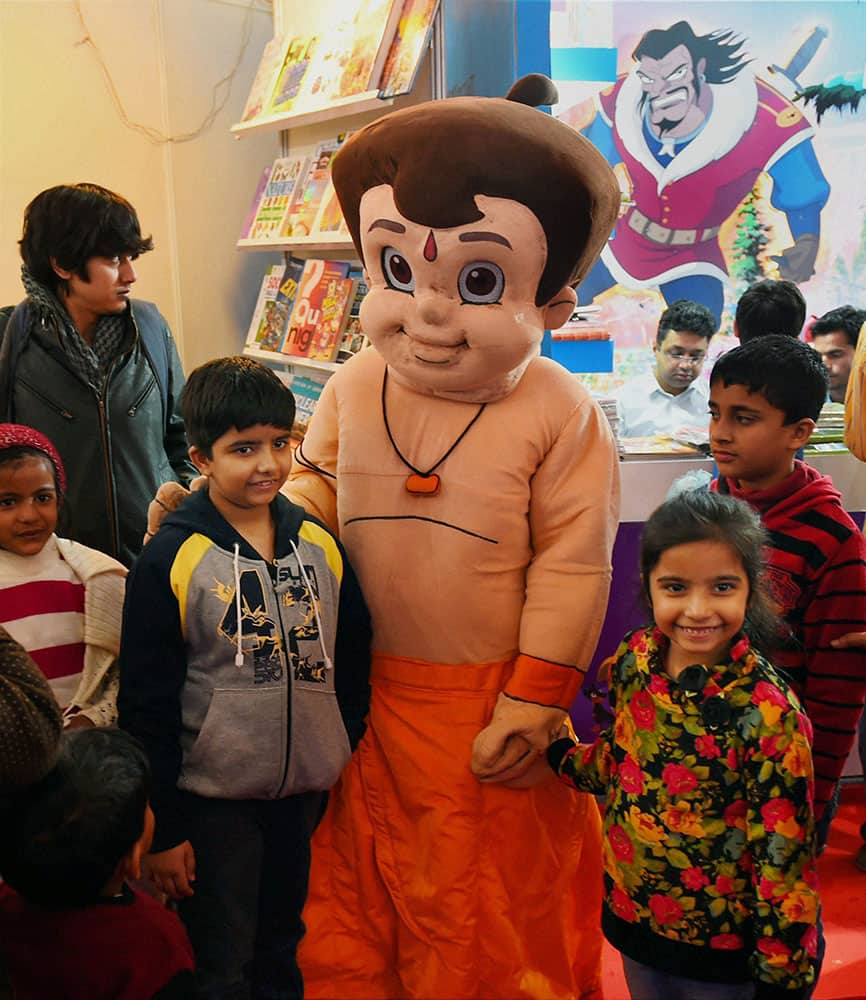 Children pose for photo with cartoon character Chhota Bheem during the 43rd World Book Fair , in New Delhi.