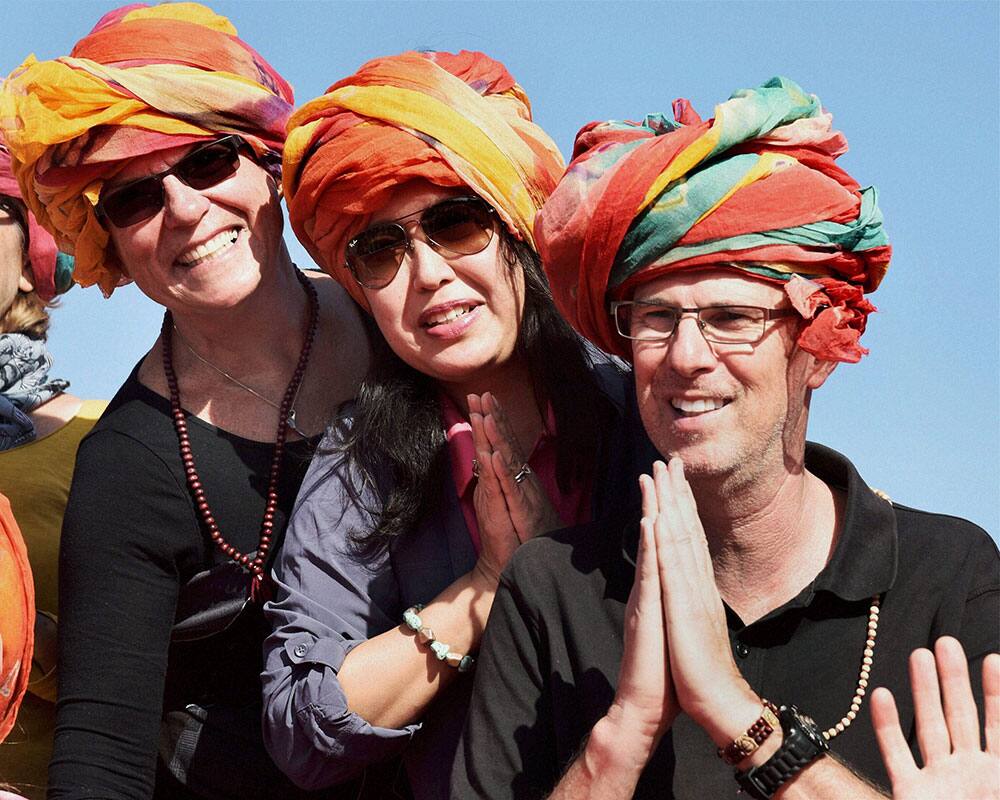 Foreign tourists during 23rd International Camel Festival at Bikaner in Rajasthan.
