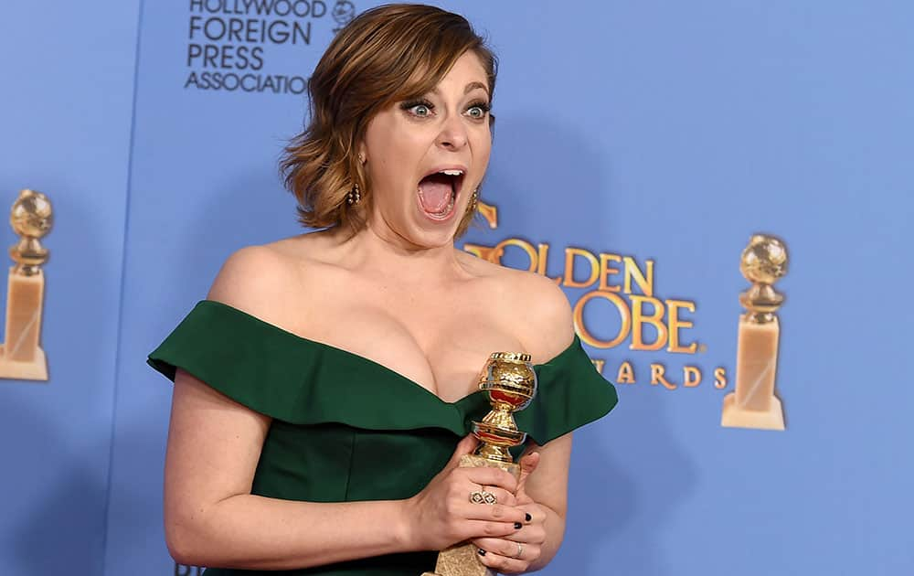 Rachel Bloom poses in the press room with the award for best actress in a TV series, comedy or musical, for her role in 