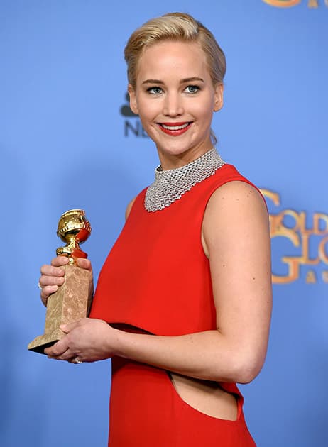 Jennifer Lawrence poses in the press room with the award for best performance by an actress in a motion picture - musical or comedy for “Joy” at the 73rd annual Golden Globe Awards at the Beverly Hilton Hotel in Beverly Hills, Calif. 