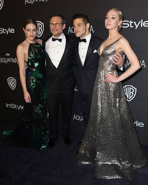 Carly Chaikin, from left, Christian Slater, Rami Malek, and Portia Doubleday, winners of the award for best television series - drama for “Mr. Robot”, arrive at the InStyle and Warner Bros. Golden Globes afterparty at the Beverly Hilton Hotel in Beverly Hills, Calif. 