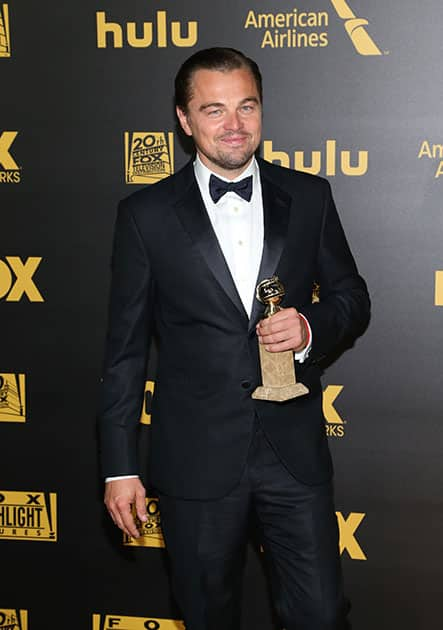 Leonardo DiCaprio poses with the award for best performance by an actor in a motion picture - drama for “The Revenant” at the FOX Golden Globes afterparty at the Beverly Hilton Hotel in Beverly Hills, Calif. 