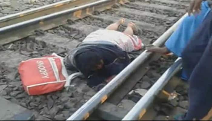 Woman escapes unhurt as train passes over her in West Bengal - Watch video
