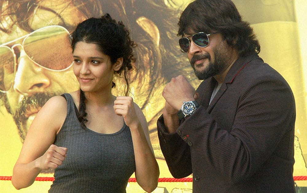 Bollywood Actors R. Madhavan with Boxer Ritika Singh during promotional event of upcoming film Saala Khadoos in Mumbai.