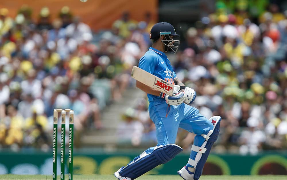 India's Virat Kohli evades a ball during their one day international cricket match against Australia in Perth, Australia.