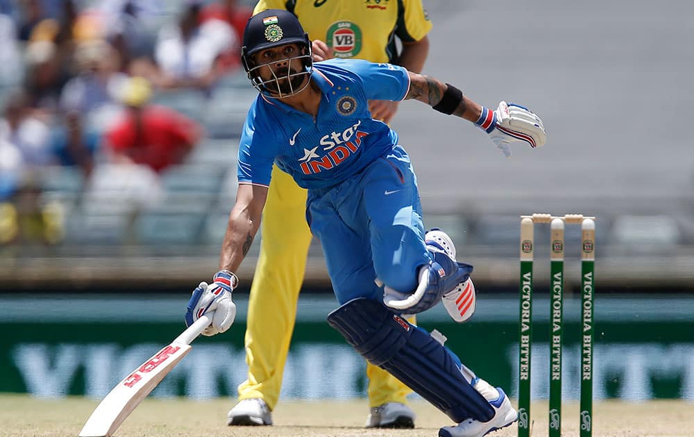 India's Virat Kohli runs to his crease during their one day international cricket match against Australia in Perth, Australia.